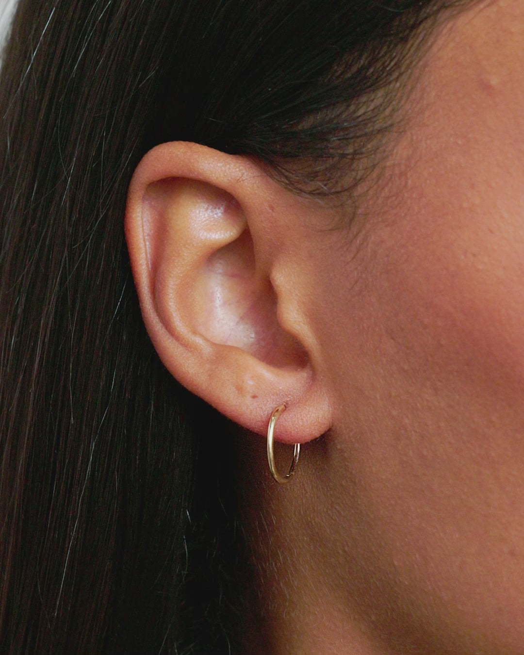 Woman wearing Classic Gold Huggie || option::14K Solid Gold, 15mm